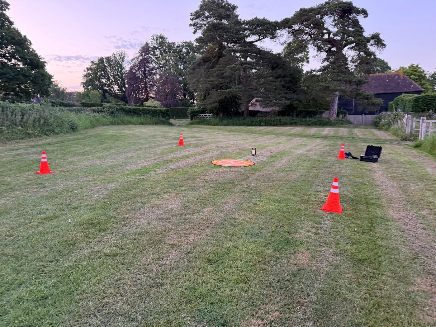Survey set-up at dusk with cones marking a drone take-off area