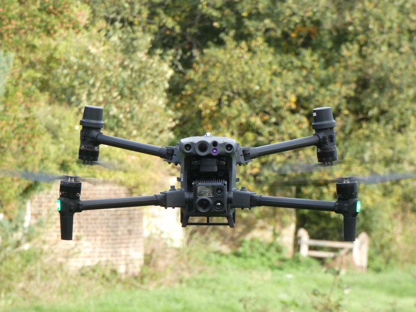 Thermal survey drone hovering above grass