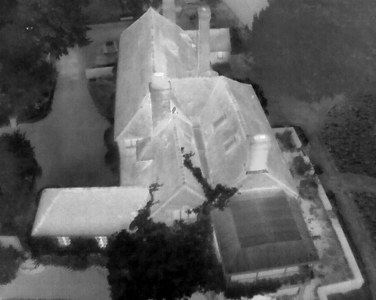 Thermal drone view of a house at night